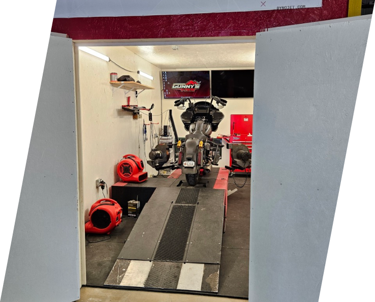 A motorcycle shop with a lot of equipment in it